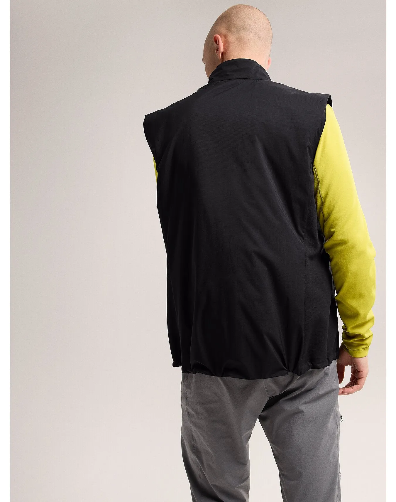 Certainly! Here’s an optimized title for the e-commerce product:

“Atom Vest for Men - Lightweight Performance Packable Vest for Athletic and Casual Wear”

Let me know if you need any further modifications!